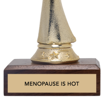 Gold trophy with a wooden base that says 'Menopause is Hot' on a white background