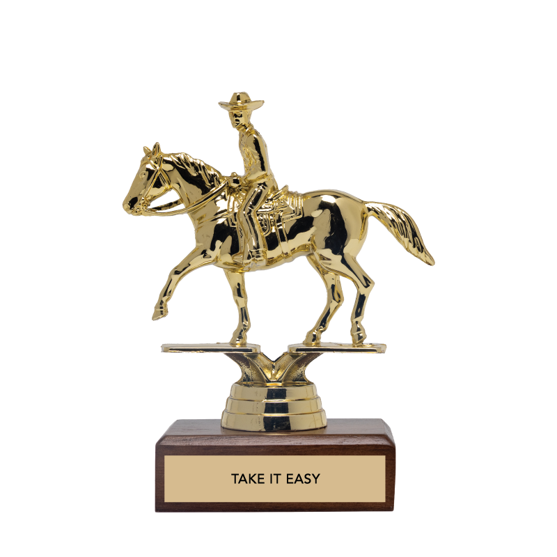 Gold trophy of a rider on a horse with 'Take It Easy' on a wooden base against a white background
