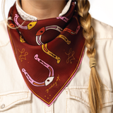 Person wearing a red bandana with horse shoe designs and 'giddy up' text.