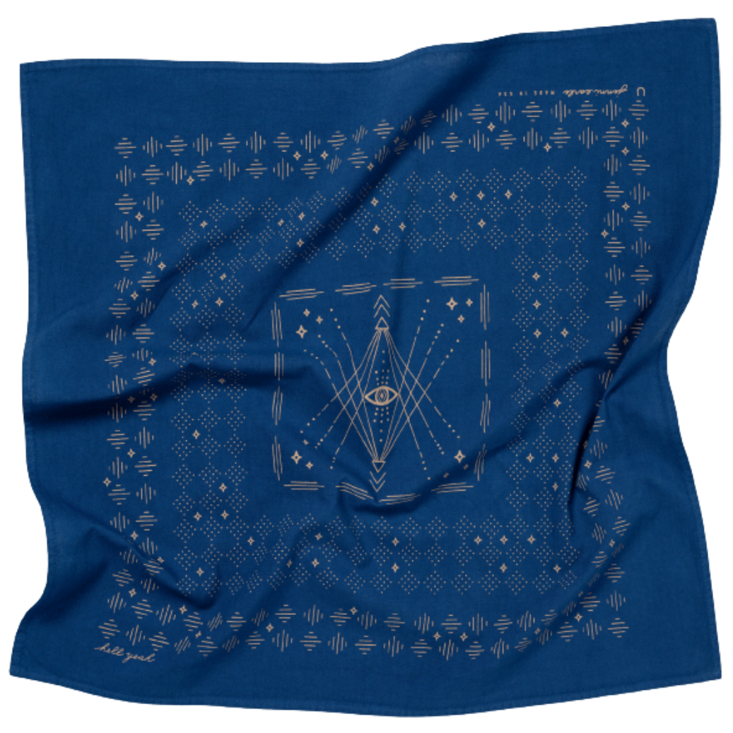 indigo blue bandana with tan geometric patterns and the mantra hell yeah