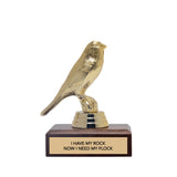 Gold bird-shaped trophy with a wooden base and 'i have my rock, now i need my flock' text on a white background