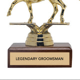 Gold horse and rider trophy with wooden base and 'Legendary Groomsman' text on a white background