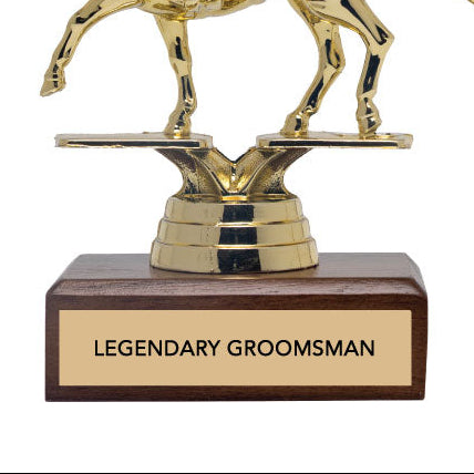Gold horse and rider trophy with wooden base and 'Legendary Groomsman' text on a white background