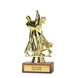 A gold-colored trophy figurine depicting a couple dancing, mounted on a rectangular brown wooden base with a gold plaque that reads 'NO LONGER LIVIN' IN SIN'.