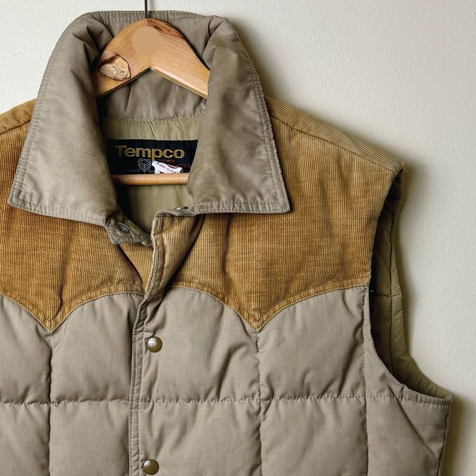 A vintage Tempco quilted puffer vest in a muted grayish-brown color, featuring tan corduroy yoke panels and trim. upcycled by jenni earle