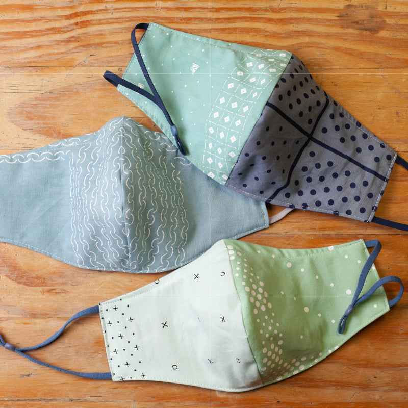 this is a set of three upcycled face masks, that help guard against covid-19 and the delta variant. made from our hand dyed bandanas. they are three layered, have a bendable nose piece and adjustable ear straps.